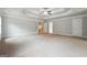 Spacious main bedroom features a tray ceiling, ceiling fan and neutral color palette at 3140 Jackson Creek Dr, Stockbridge, GA 30281
