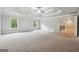 Spacious main bedroom features a tray ceiling, ceiling fan and plush carpet at 3140 Jackson Creek Dr, Stockbridge, GA 30281
