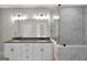 Modern bathroom featuring double sinks and glass shower enclosure at 585 Highway 155 North N, Mcdonough, GA 30252