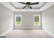 Well-lit bedroom with a ceiling fan and two windows offering natural light at 585 Highway 155 North N, Mcdonough, GA 30252