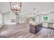 Spacious living room features a modern fireplace, ceiling fan, and an island at 585 Highway 155 North N, Mcdonough, GA 30252