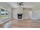 Spacious living room with hardwood floors and a cozy fireplace at 170 Paislee Park (Lot #8 Paislee Park) Dr, Fayetteville, GA 30215