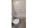 White bathroom with a tub and toilet at 5300 Forest Downs Ln, Atlanta, GA 30349