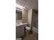 Bathroom features tile floors, single sink vanity and shower at 5300 Forest Downs Ln, Atlanta, GA 30349