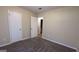Empty bedroom with two closets and neutral walls at 5300 Forest Downs Ln, Atlanta, GA 30349