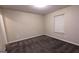 Bedroom features carpeted floor and window with blinds at 5300 Forest Downs Ln, Atlanta, GA 30349