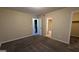 Spacious bedroom with carpeted floors and access to bathroom at 5300 Forest Downs Ln, Atlanta, GA 30349
