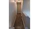 Hallway with wood floors and neutral walls at 5300 Forest Downs Ln, Atlanta, GA 30349