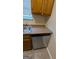 Close up of a stainless steel dishwasher and sink at 5300 Forest Downs Ln, Atlanta, GA 30349