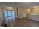 Spacious open-concept living area featuring hardwood floors and a large bay window at 5300 Forest Downs Ln, Atlanta, GA 30349