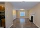 Open-concept living room with fireplace and lots of natural light from a window at 5300 Forest Downs Ln, Atlanta, GA 30349