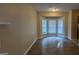 Inviting living area featuring hardwood floors and a large bay window at 5300 Forest Downs Ln, Atlanta, GA 30349