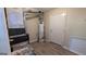 Utility room with wood look floors and water heater at 5300 Forest Downs Ln, Atlanta, GA 30349