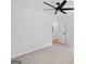 Neutral bedroom featuring a ceiling fan, plush carpet, and ample natural light at 1928 Wildwood Dr, Decatur, GA 30032