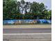Mural in East Lake welcomes you to the villages with artwork of neighbors and the Atlanta skyline at 1928 Wildwood Dr, Decatur, GA 30032
