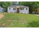 Charming renovated single Gathering home with a large front yard and inviting entrance at 1928 Wildwood Dr, Decatur, GA 30032