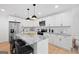 Contemporary kitchen with granite countertops, stainless steel appliances, and a breakfast bar at 1928 Wildwood Dr, Decatur, GA 30032