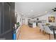 Open-concept living space with modern furnishings, light wood floors, and a stylish dining area at 1928 Wildwood Dr, Decatur, GA 30032