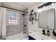 Beautiful bathroom with a shower over the tub and a modern vanity with stylish fixtures at 2013 Marco Dr, Decatur, GA 30032