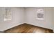 The bedroom features hardwood floors and natural light through the windows at 2013 Marco Dr, Decatur, GA 30032