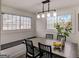 Bright dining room featuring modern lighting, bench seating, and natural light from the multiple windows at 2013 Marco Dr, Decatur, GA 30032