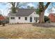 Charming, cottage-style home featuring a newly painted exterior, landscaped yard, and mature shade trees at 2013 Marco Dr, Decatur, GA 30032