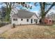 Charming, cottage-style home featuring a newly painted exterior, landscaped yard, and mature shade trees at 2013 Marco Dr, Decatur, GA 30032