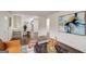 Open-concept living room with hardwood floors, modern decor, and seamless flow to the adjacent kitchen at 2013 Marco Dr, Decatur, GA 30032