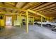 This spacious garage interior features high ceilings, exposed beams, and ample space for storage at 2955 Peeksville Rd, Locust Grove, GA 30248