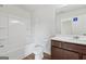 Clean bathroom with a shower-tub combo, modern vanity, and tile flooring at 4001 Avalon Sw Rd, Atlanta, GA 30331