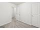 A bedroom offers neutral carpet, white walls and two closets at 4001 Avalon Sw Rd, Atlanta, GA 30331