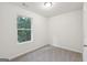 Cozy bedroom with neutral carpet and a bright window offering a peaceful view at 4001 Avalon Sw Rd, Atlanta, GA 30331