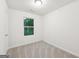 An empty bedroom with neutral colored carpet and white walls at 4001 Avalon Sw Rd, Atlanta, GA 30331