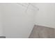 Interior of a closet showing white wire shelving and neutral carpet at 4001 Avalon Sw Rd, Atlanta, GA 30331