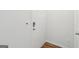 View of a white front door with electronic entry and wood-look flooring at 4001 Avalon Sw Rd, Atlanta, GA 30331