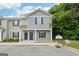 Charming townhome exterior with well-maintained gray siding, covered front porch, and a basketball hoop in the yard at 4001 Avalon Sw Rd, Atlanta, GA 30331