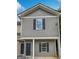 Two-story townhome with gray siding, black shutters, and covered front porch at 4001 Avalon Sw Rd, Atlanta, GA 30331