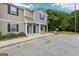 Charming townhome exterior showcasing a well-kept lawn, covered porch, and attractive curb appeal at 4001 Avalon Sw Rd, Atlanta, GA 30331