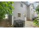 Exterior shot of a two-story townhome with gray siding and a small back patio at 4001 Avalon Sw Rd, Atlanta, GA 30331