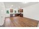 Kitchen features stainless appliances, wood cabinets and views into the living space at 4001 Avalon Sw Rd, Atlanta, GA 30331
