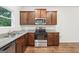 Kitchen features stainless appliances, wood cabinets, and granite countertops at 4001 Avalon Sw Rd, Atlanta, GA 30331