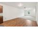 Spacious living area featuring wood floors, ample natural light, and eat-in kitchen with stainless steel appliances at 4001 Avalon Sw Rd, Atlanta, GA 30331
