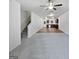 Open concept living room and kitchen space with gray carpet and wood flooring at 4001 Avalon Sw Rd, Atlanta, GA 30331