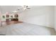 Open living room and eat-in kitchen combo featuring wood floors and stainless steel appliances at 4001 Avalon Sw Rd, Atlanta, GA 30331
