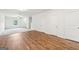 Open-concept living area boasts carpet and laminate flooring and a ceiling fan at 4001 Avalon Sw Rd, Atlanta, GA 30331