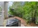 View of the patio with AC unit and lush green trees at 4001 Avalon Sw Rd, Atlanta, GA 30331