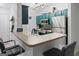 Modern kitchen with stainless steel appliances, custom cabinets, and breakfast bar seating at 2700 Pine Ne St # 2108, Atlanta, GA 30324