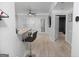 Bright, open living area with light wood floors, bar seating, and access to the outdoors at 2700 Pine Ne St # 2108, Atlanta, GA 30324