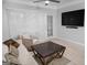 Cozy living room with a large television, ceiling fan, and natural light at 2700 Pine Ne St # 2108, Atlanta, GA 30324