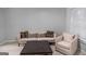 Well-lit living area featuring stylish sofa, accent chair, and contemporary coffee table at 2700 Pine Ne St # 2108, Atlanta, GA 30324